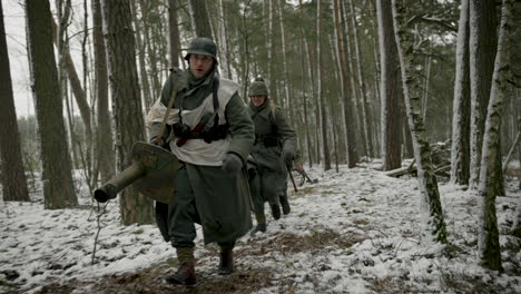 german soldiers in winter forest
