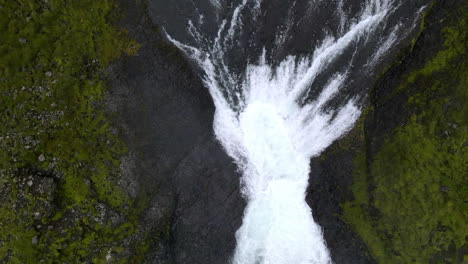 aerial zenith shot of the haifoss waterfall in the mountain gorge of fossárdalur, in iceland