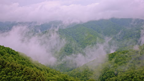 drone glides over the misty expanse of the great smokies