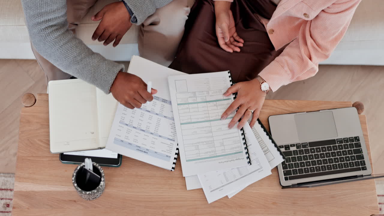 Couple hands, documents and budget planning