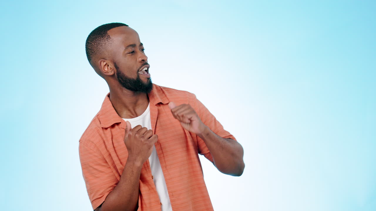 African man, dancing and smile in studio