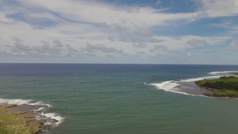 Drone-moving-slowing-over-the-mouth-of-the-bay-in-Guam