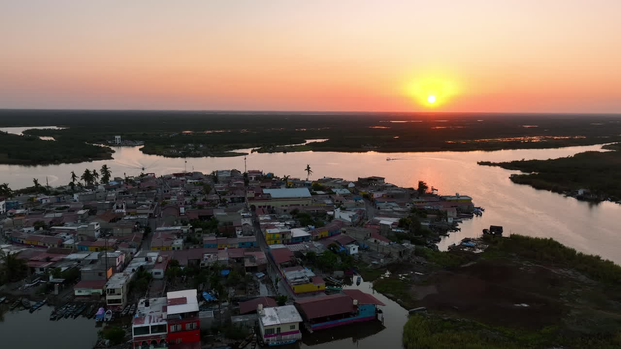 Aerial view backwards over the Mexcaltitan Magic Town, sunset in Nayarit, Mexico