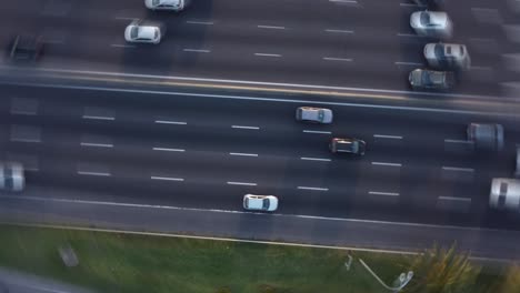 Fast-vertigo-circling-pov-of-cars-and-vehicles-driving-on-General-Paz-highway-in-Buenos-Aires,-Argentina