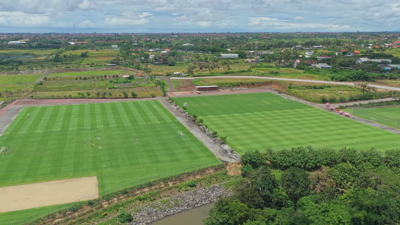 Aerial view of bali united training center soccer fields