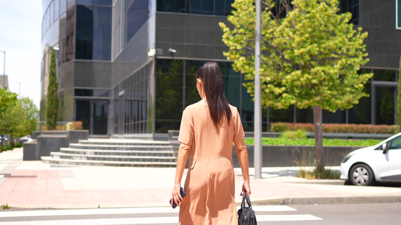 Woman Walking on Crosswalk in Urban Setting