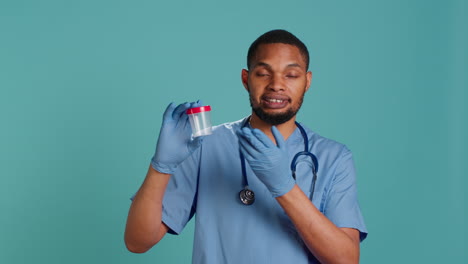 Portrait-of-nurse-holding-blood-sample-container,-doing-medical-investigation