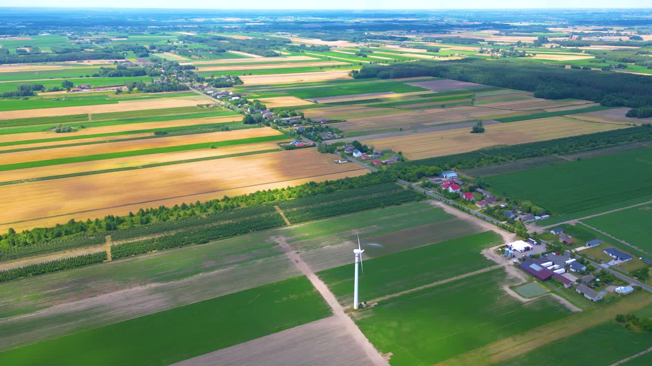 Aerial drone view of wind power turbines, part of a wind farm