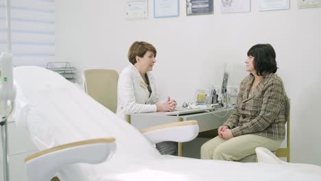 patient having consultation with female doctor in office