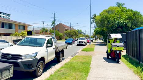 mailman delivers letters on a sunny street