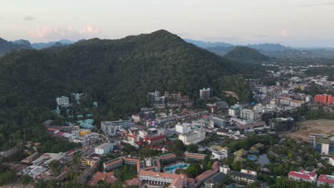 Ao-Nang-beach,-town-and-mountain-at-sunset,-Krabi,-Thailand