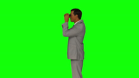 Businessman-looking-through-binoculars