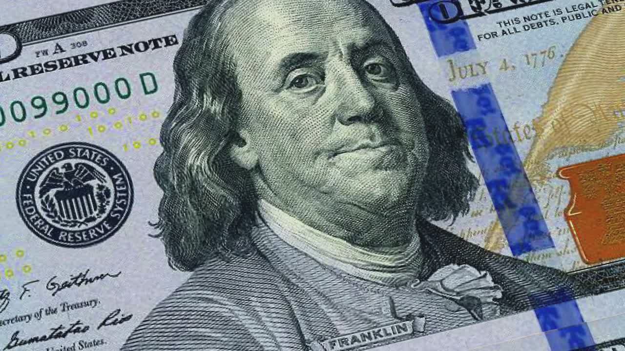 Sheet of $100 bills / printing dollar bills stock video 4K