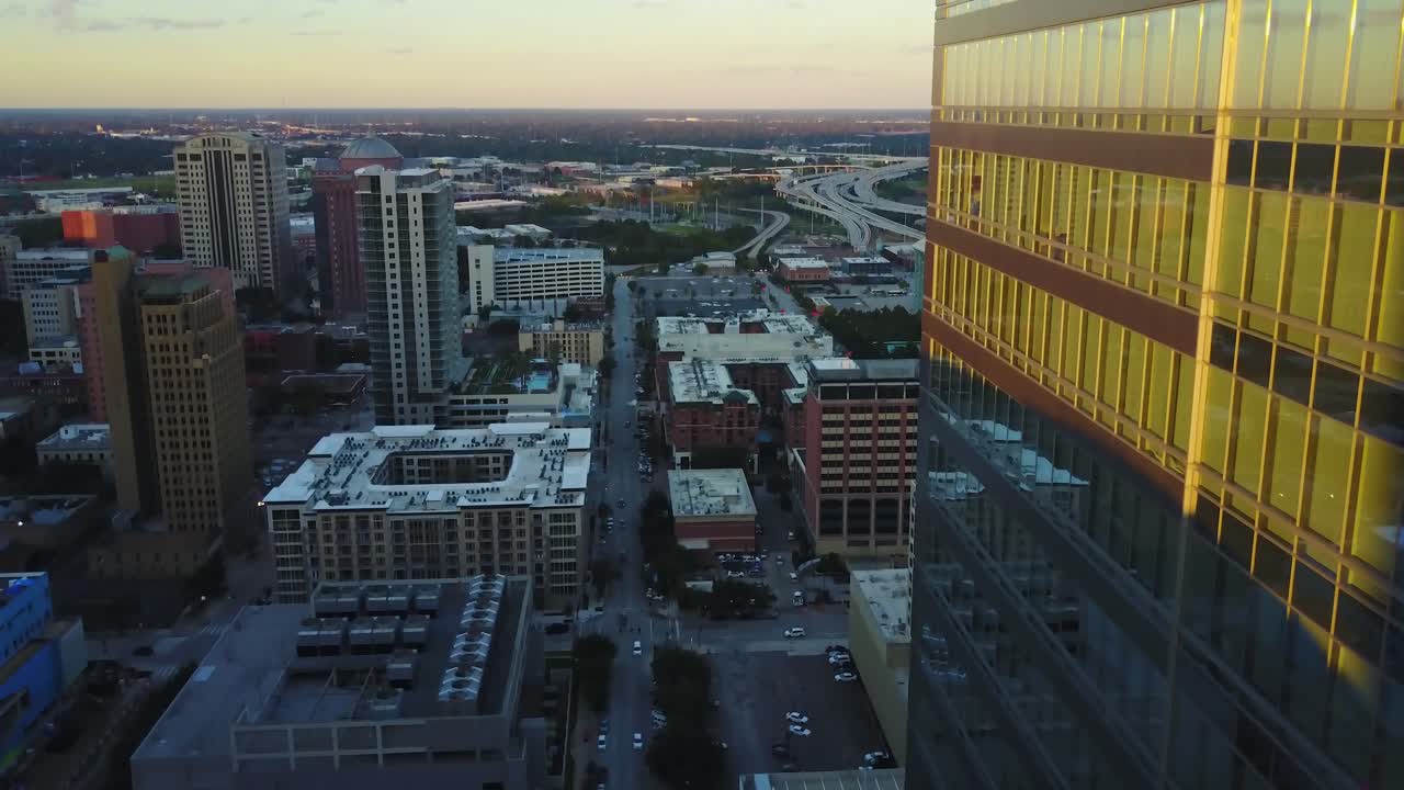 Downtown Houston Texas USA on Sunsest Sunlight. Drone Aerial View of Business Buildings and Street Traffic