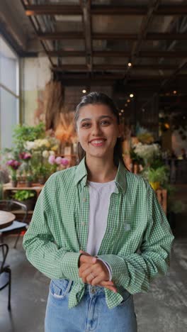 young woman smiling in a floral shop