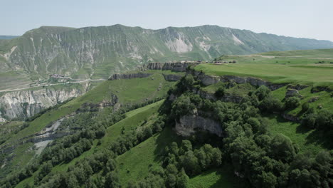 mountainous landscape with village and road