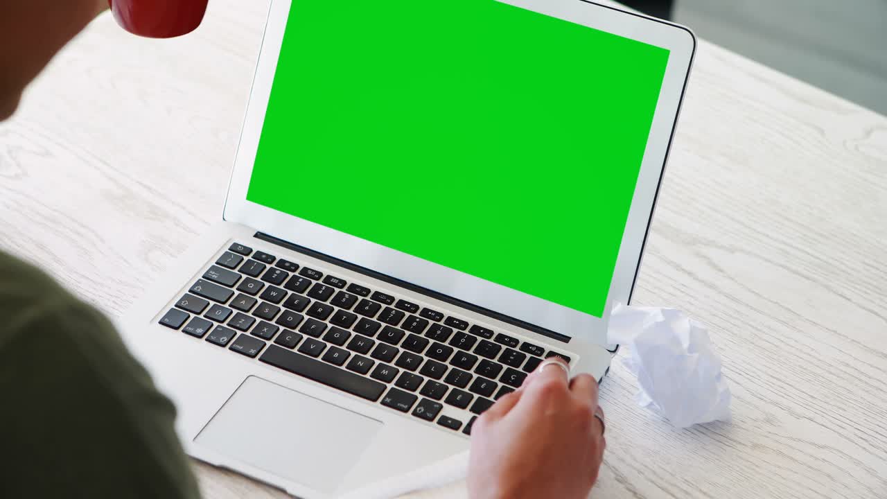 Female executive working on laptop while having coffee 4k