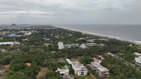 elevated shot of pondicherry’s seafront with a layered backdrop of urban life
