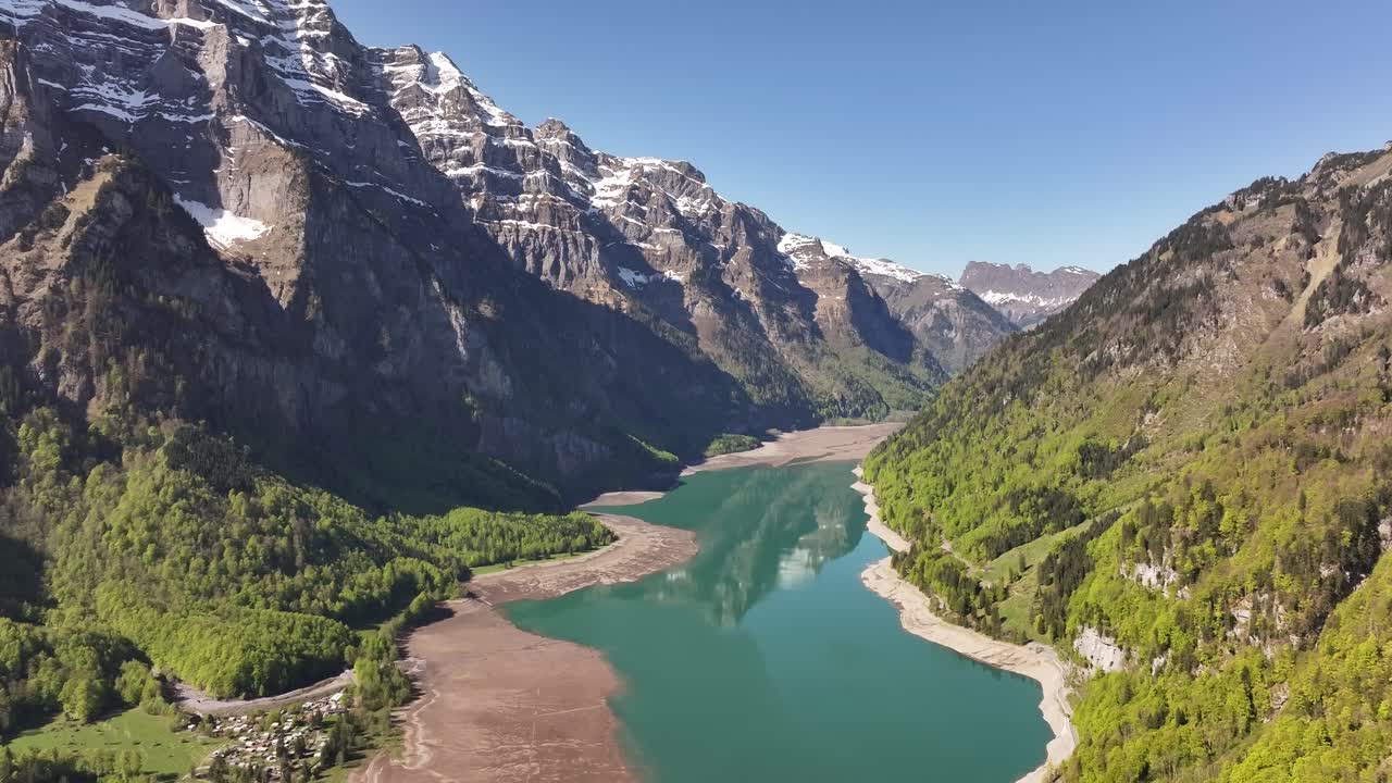 Klontalersee Lake Surrounded By Mountains In Summer In Glarus, Switzerland. - aerial shot