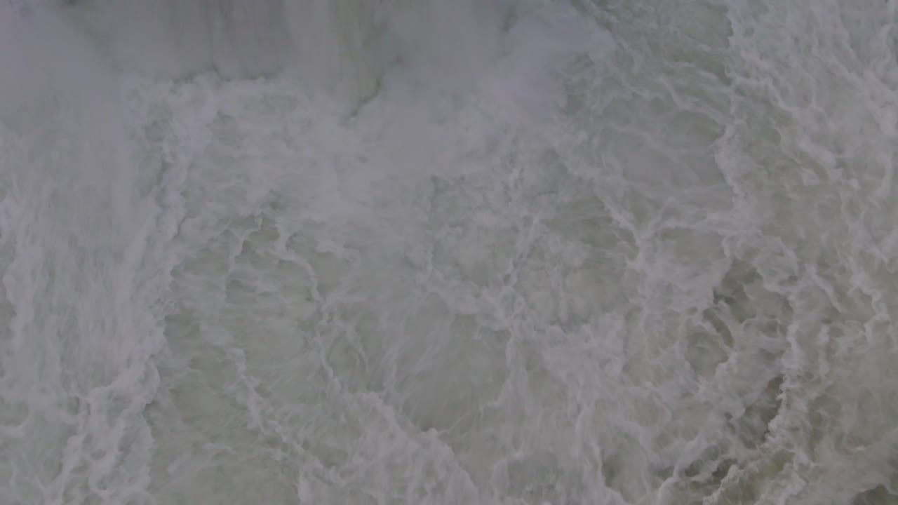 Drone and close-up footage showing the mesmerizing spray behind a waterfall. Marvel at the mist, cascading water, and surrounding greenery that highlights Nepal’s stunning natural landscapes