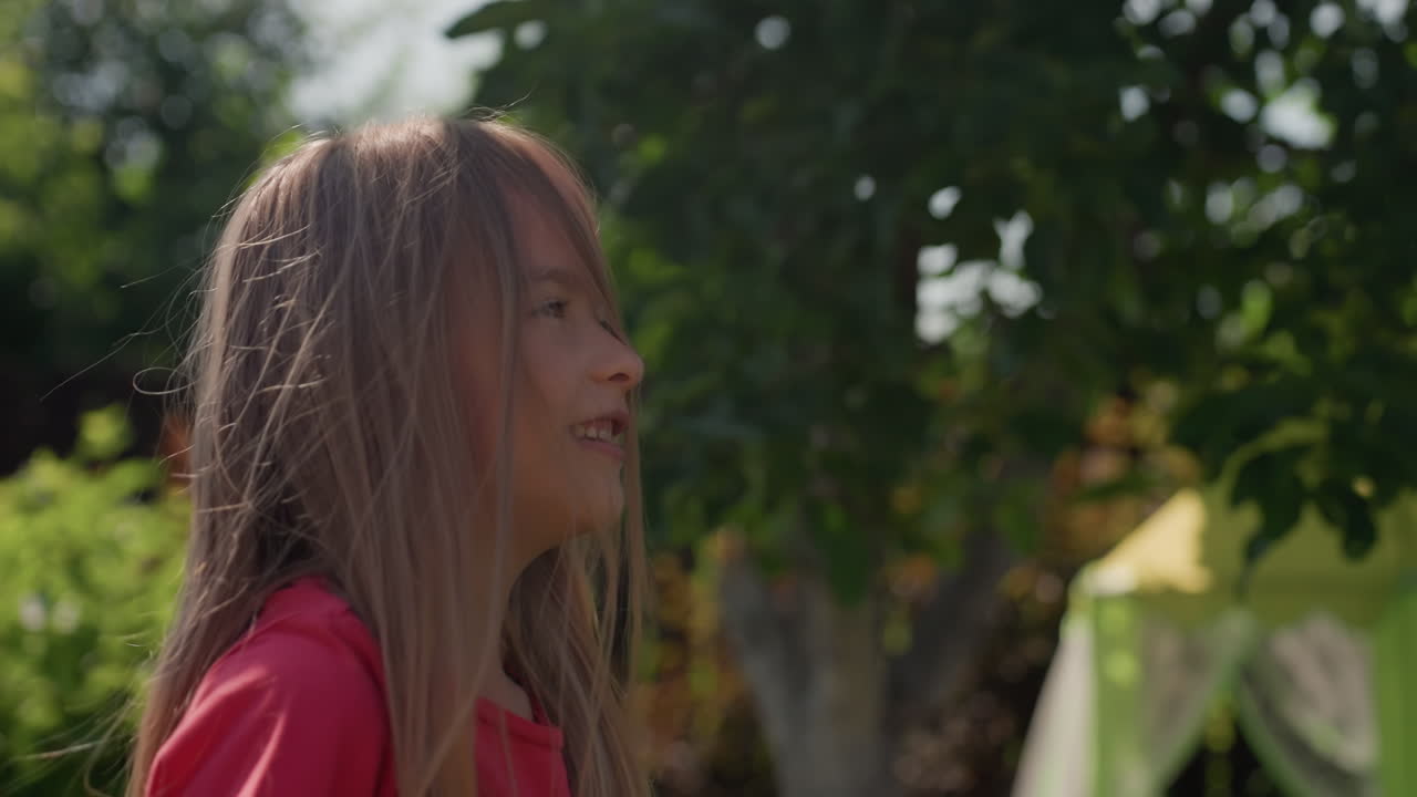 Young Woman With Relaxed Expression, Candid Portrait Of Girl Enjoying Sunlight And Peaceful Surroundings, Youthful Female Captured In Casual Moment With Sparkling Smile In Shaded Botanical Setting