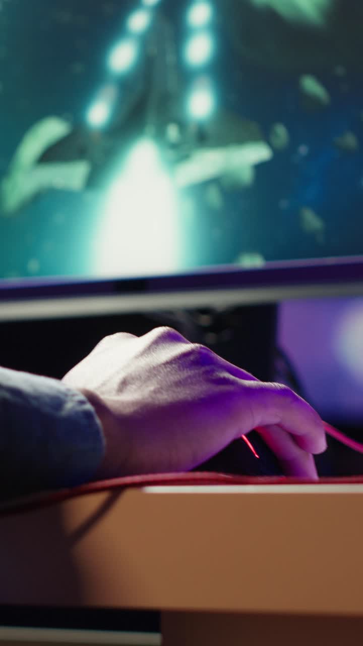 Vertical video Gamer enjoying high quality game, streaming it online, flying spaceship
