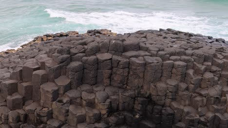 time-lapse of ocean waves hitting a rocky shore