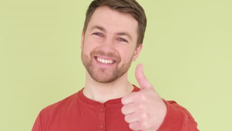 positive young gay man holding poster with lgbt slogan and smiling at camera positive young gay man holding poster with lgbt slogan and smiling at camera