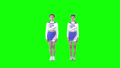 two young cheerleaders dancing in studio