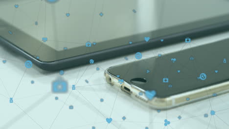 Animation of network of digital icons against close up of smartwatch, smartphone and digital tablet