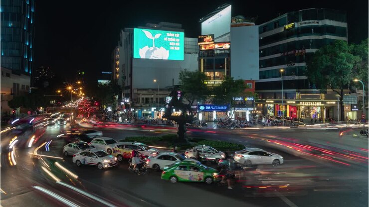 Nighttime City Street Scene with Traffic Trails in a Roundabout