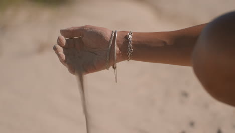 Woman-dropping-sand
