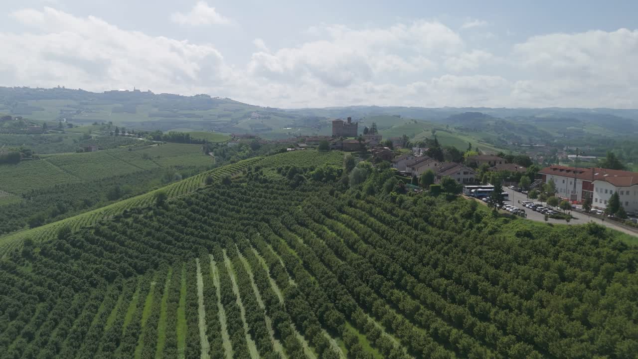 Grinzane Cavour castle, UNESCO site, Cuneo, Piedmont, Italy. 4k aerial view of the castle and the Vineyard. Langhe-Roero and Monferrato. Moving towards the castle from the vineyards