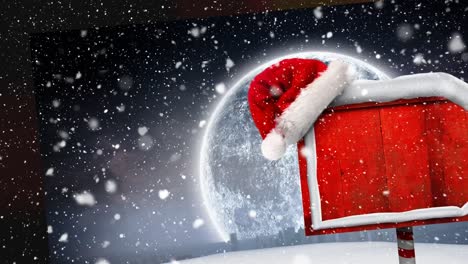 Animation-of-snow-falling-over-santa-hat-on-red-wooden-sign-with-copy-space