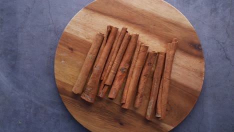 cinnamon sticks on wooden board