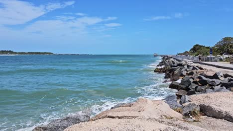 Static-view-of-path-with-rock-wall-at-cocoa-beach,-Florida