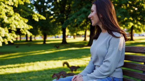 woman sitting on park bench, enjoying the outdoors