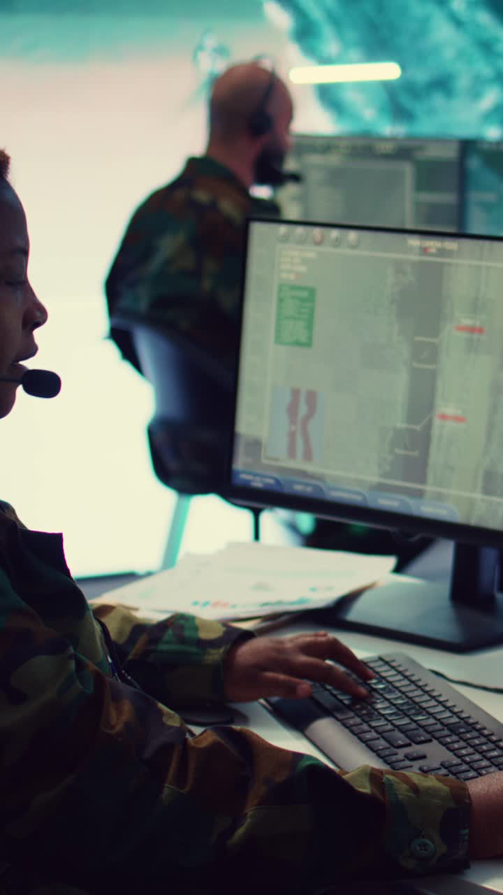 Woman in Military Uniform Working in Control Room with Headset