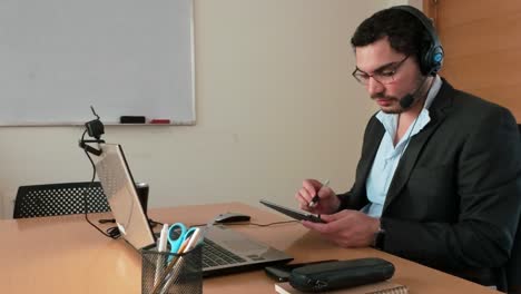 young man in online course with tablet