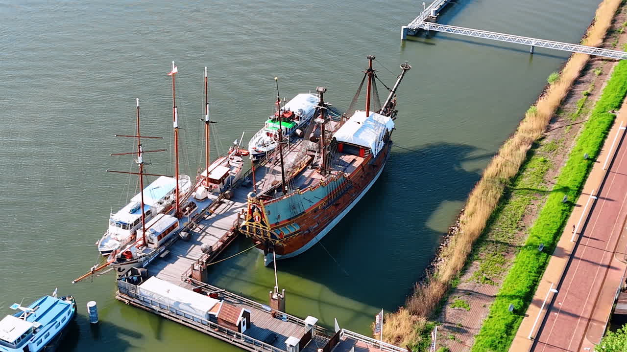 Berth with the ship Batavia at the waterfront of Lelystad, the Netherlands. Famous 17-century water vehicle reconstruction in the Historical Museum Batavialand. Aerial view.