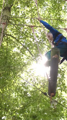 child enjoying treetop adventure