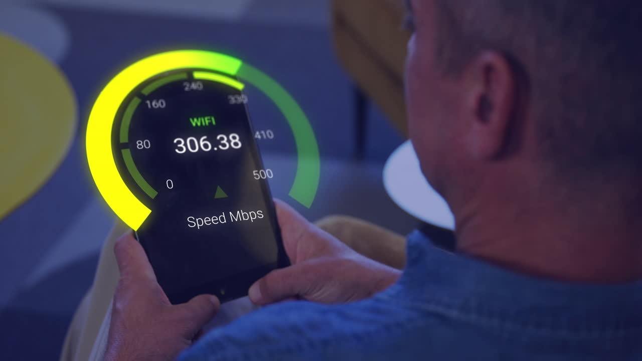 Animation of speedometer data processing over caucasian businessman using tablet