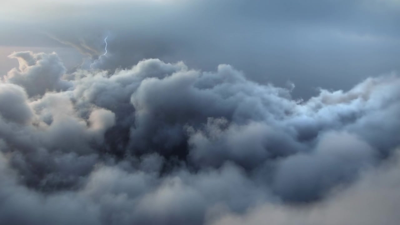 Dramatic Aerial Storm Clouds At Dusk, Layered Cumulus And Stratus Forming Dense Billowing Masses With Soft