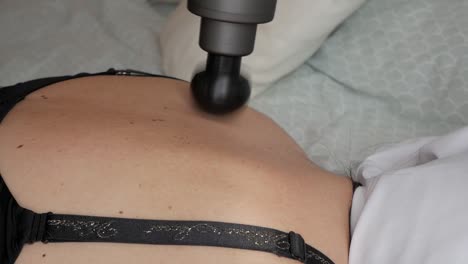 back massage using a textured roller for muscle relaxation and sport recovery