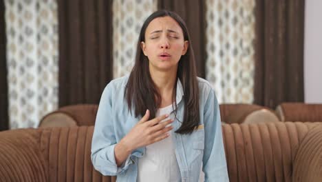 indian woman feeling breathlessness and having asthma attack