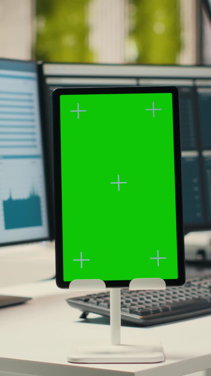 Vertical Video Contemporary office space equipped with green screen on tablet