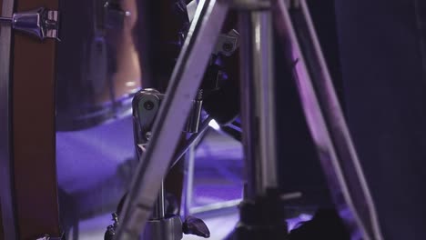 drummer plays percussion instruments at a concert as part of a musical group