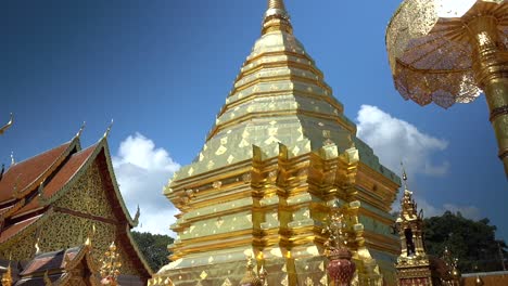 amazingly decorated golden chedi in a old buddhist temple in chiang mai, thailand.