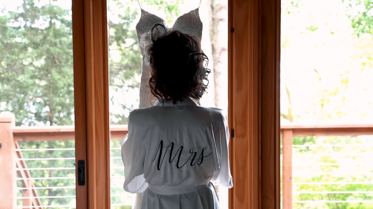 Bride to be looking at her dress before her wedding