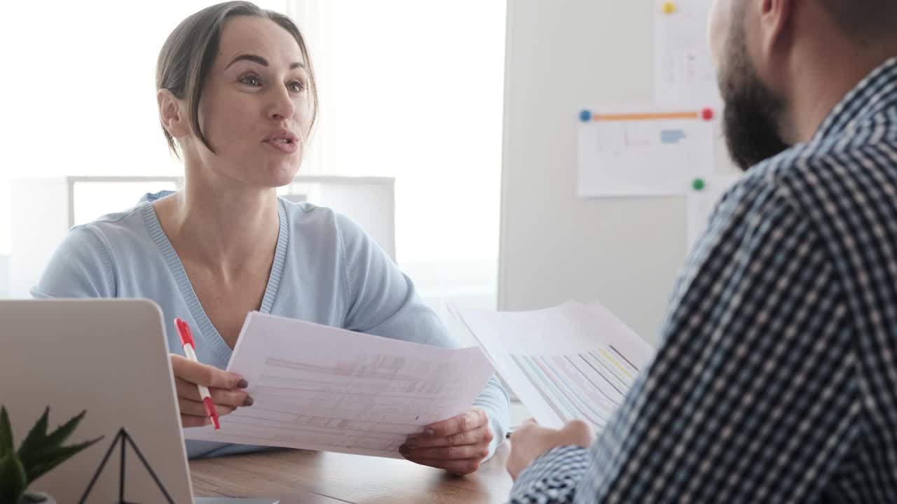 Business partners saying goodbye while shaking hands after meeting